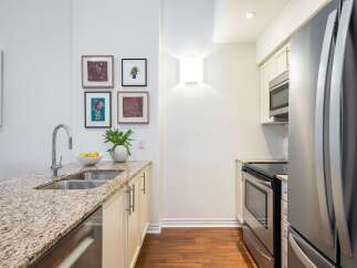 This stunning kitchen boasts a modern design with granite countertops and stainless steel appliances.