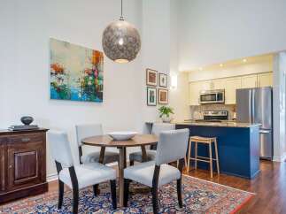This stunning property boasts a modern kitchen with stainless steel appliances and a stylish island.