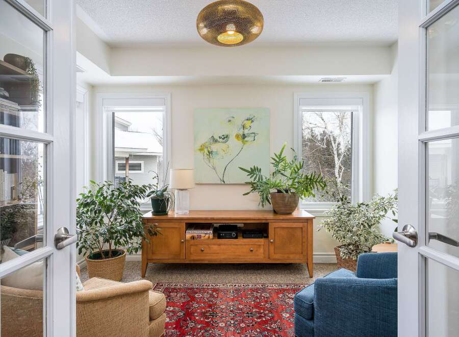 Step into a bright and inviting sunroom, perfect for relaxation and enjoying natural light.