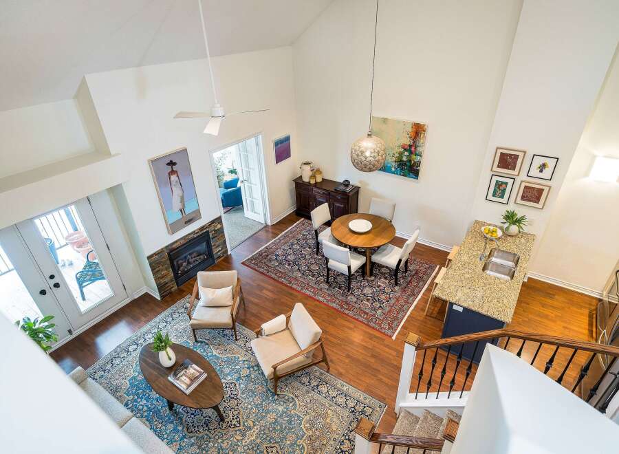 This stunning property boasts a spacious, open-concept living area with soaring ceilings and abundant natural light.