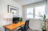 This inviting home office space features a sleek desk, perfect for productivity.