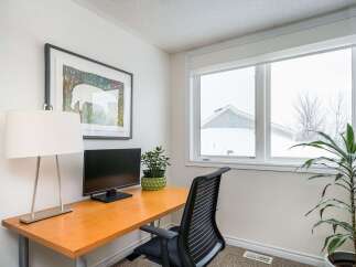 This inviting home office space features a sleek desk, perfect for productivity.