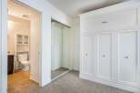 Step into this bright and airy bedroom, featuring a large closet with ample storage space.