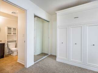 Step into this bright and airy bedroom, featuring a large closet with ample storage space.