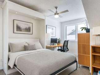 Discover the perfect blend of comfort and functionality in this stylish bedroom.