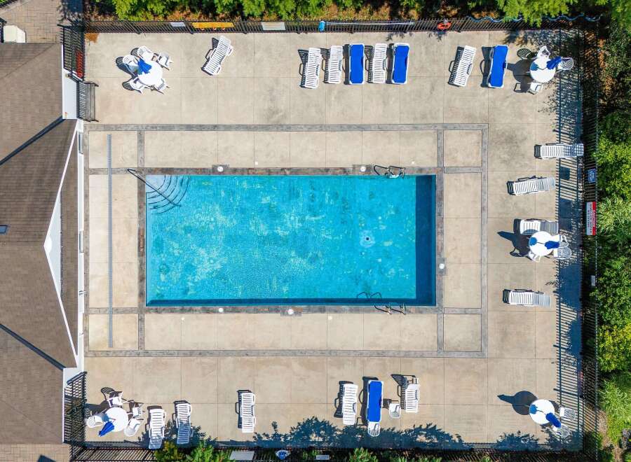 Enjoy the ultimate relaxation at this stunning property featuring a sparkling pool and ample lounging space.