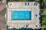 Enjoy the ultimate relaxation at this stunning property featuring a sparkling pool and ample lounging space.