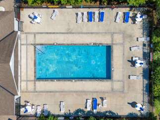 Enjoy the ultimate relaxation at this stunning property featuring a sparkling pool and ample lounging space.