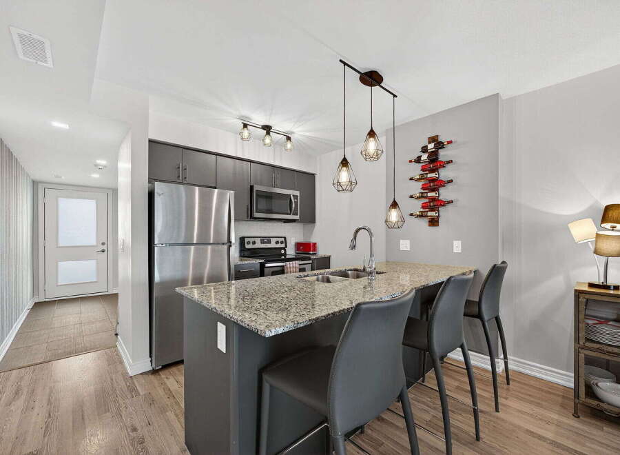 This stunning kitchen features modern design elements and high-end appliances.
