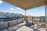 Enjoy breathtaking views from this stunning balcony overlooking the water.