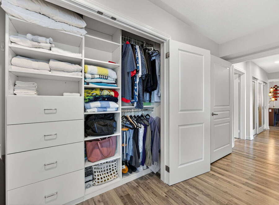 Step into organized luxury with this stunning closet! Featuring ample storage with drawers, shelves, and hanging space, this closet is designed to keep your belongings tidy and accessible.
