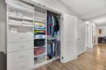 Step into organized luxury with this stunning closet! Featuring ample storage with drawers, shelves, and hanging space, this closet is designed to keep your belongings tidy and accessible.