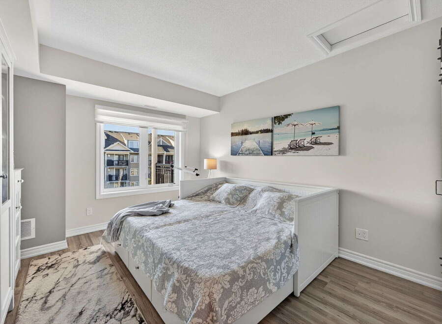 This bright and airy bedroom offers a serene retreat.