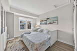 This bright and airy bedroom offers a serene retreat.