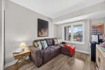 This cozy living space features a comfortable sectional sofa, perfect for relaxing.