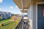 Enjoy stunning views from this beautiful condo balcony! This property features a modern grill, perfect for outdoor cooking and entertaining.