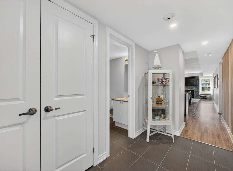 Step into this beautifully designed home and be captivated by its elegant hallway.