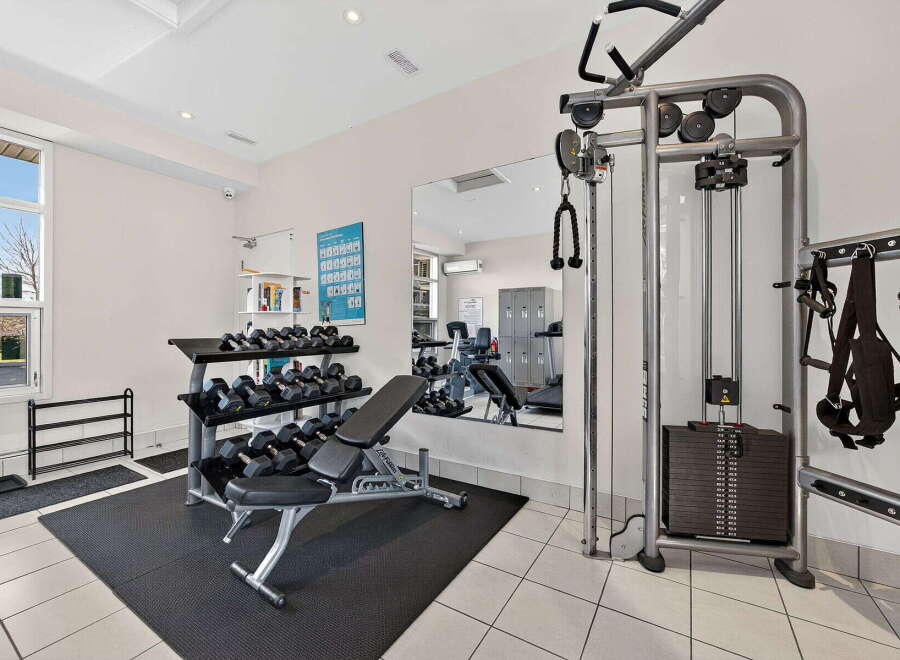 This well-equipped home gym offers a comprehensive workout experience.