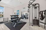 This well-equipped home gym offers a comprehensive workout experience.