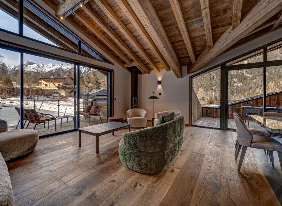 Experience luxury living in this stunning property, featuring expansive windows that frame breathtaking mountain views.