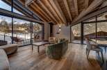 Experience luxury living in this stunning property, featuring expansive windows that frame breathtaking mountain views.