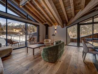 Experience luxury living in this stunning property, featuring expansive windows that frame breathtaking mountain views.