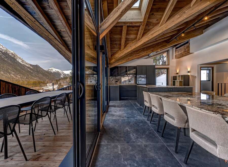 Experience luxury living with this stunning property, boasting breathtaking mountain views and a seamless blend of indoor and outdoor spaces.