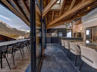 Experience luxury living with this stunning property, boasting breathtaking mountain views and a seamless blend of indoor and outdoor spaces.