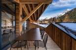Experience luxury living with this stunning property featuring a spacious outdoor dining area.