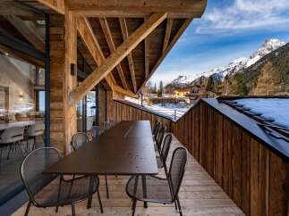 Experience luxury living with this stunning property featuring a spacious outdoor dining area.