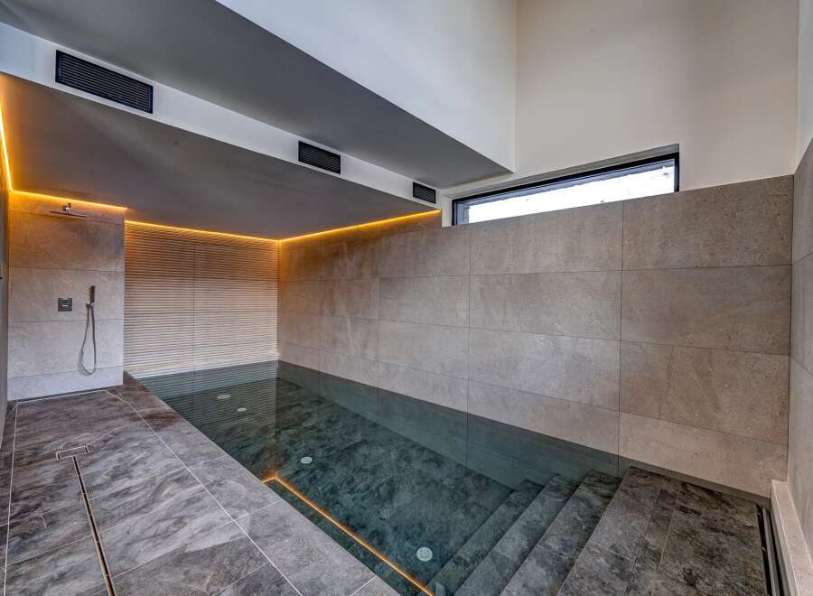 Experience luxury and relaxation in this stunning indoor pool.