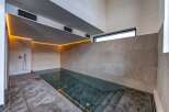 Experience luxury and relaxation in this stunning indoor pool.