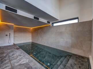 Experience luxury and relaxation in this stunning indoor pool.