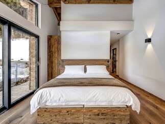Experience rustic elegance in this stunning bedroom.