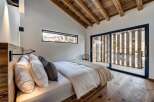 Experience the epitome of rustic elegance in this stunning bedroom.