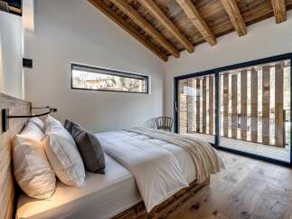 Experience the epitome of rustic elegance in this stunning bedroom.