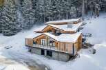 This stunning mountain home showcases a beautiful blend of natural materials and modern design.