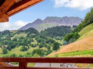 Experience breathtaking mountain views from this charming property, nestled amidst lush green hills and dense forests.