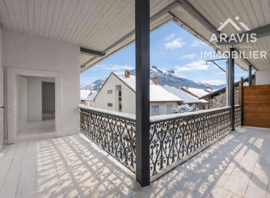 Enjoy breathtaking mountain views from this charming balcony.
