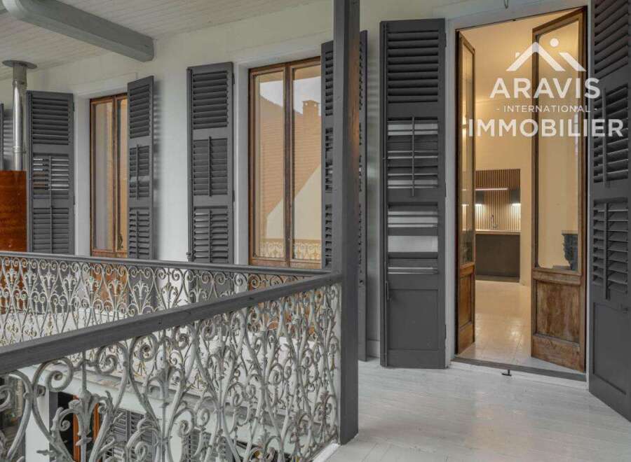 Discover the charm of this exquisite property, featuring elegant shutters and a beautifully crafted wrought iron balcony.
