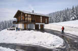This stunning chalet-style home offers a perfect blend of rustic charm and modern luxury.