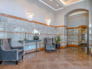Step into luxury with this stunning lobby, showcasing elegant design and high-end finishes.