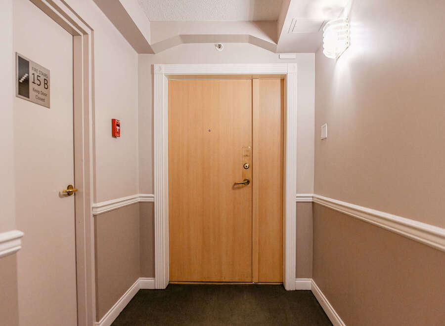 This inviting hallway showcases a well-maintained entrance, perfect for welcoming guests.