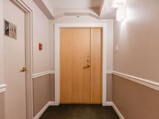 This inviting hallway showcases a well-maintained entrance, perfect for welcoming guests.