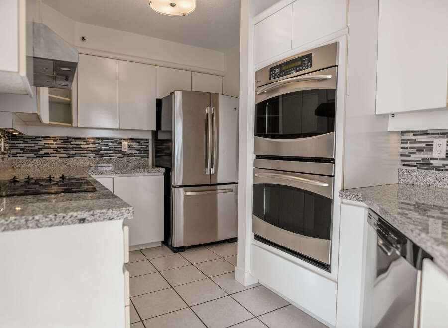 This stunning kitchen boasts modern appliances and sleek design.