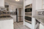 This stunning kitchen boasts modern appliances and sleek design.