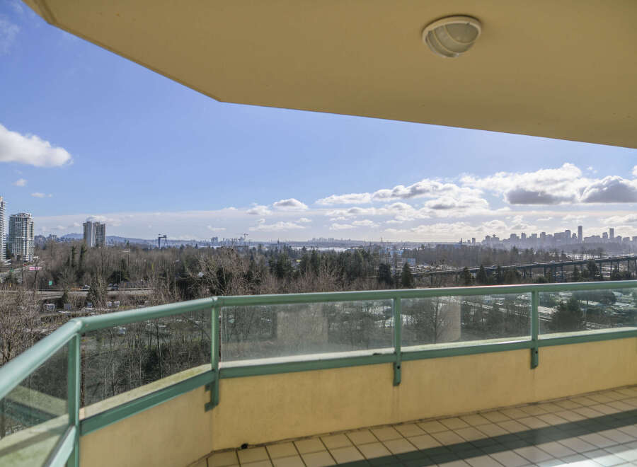Enjoy breathtaking city views from this stunning balcony.