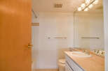 This bathroom features a clean and bright design, perfect for a relaxing space.