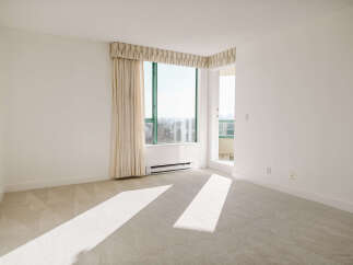 This bright and airy room features a large window that lets in plenty of natural light.