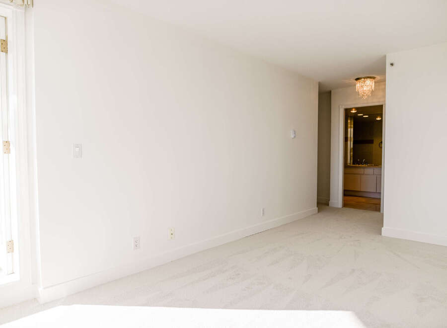 This bright and airy room offers a blank canvas for your design vision.